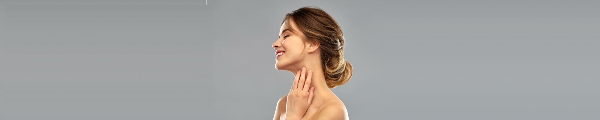 Woman touching face.